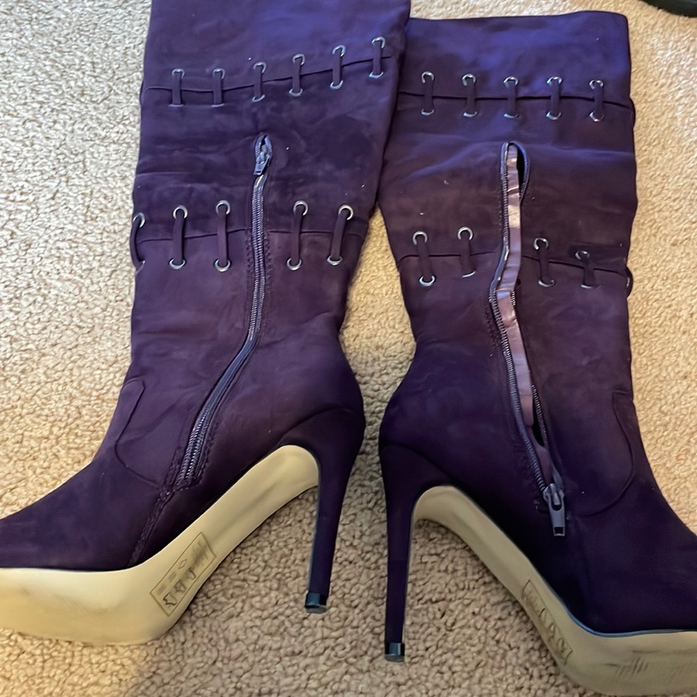 Plum color boots dress up or down . Worn once